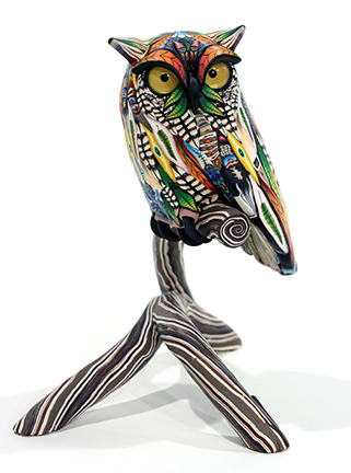 Small Yellow Eyed Owl by